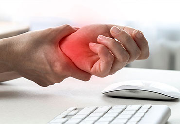 Patient suffering from carpal tunnel syndrome due to typing