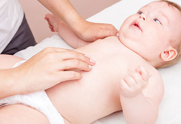 Infant receiving chiropractic care for colic