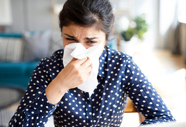 Woman in need of allergy relief through chiropractic care