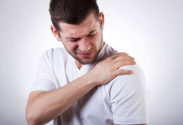 Man suffering with frozen shoulder