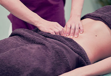 Patient receiving myofascial release treatment for infertility