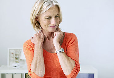 Woman needing neck and shoulder pain relief