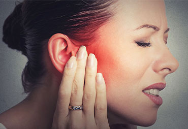 Woman suffering with severe inner ear infection