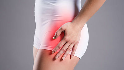 Woman suffering with hip pain
