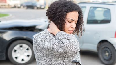 Woman suffering from whiplash